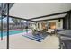 Screened-in patio with a cozy seating area and a view of the inviting private pool at 6002 34Th W Ave, Bradenton, FL 34209