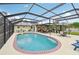 The sparkling pool features a brick trim and a sunny patio with dining and lounging areas at 6002 34Th W Ave, Bradenton, FL 34209