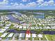 Community aerial view featuring waterfront access, a marina, pool and many homes at 617 Fairmount Dr, North Port, FL 34287