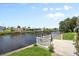 Relax on the patio in this backyard with water views at 617 Fairmount Dr, North Port, FL 34287