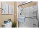 Modern bathroom with glass enclosed shower and tiled walls at 617 Fairmount Dr, North Port, FL 34287