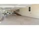 Spacious carport featuring a wheelchair ramp, covered parking, and outdoor seating area at 617 Fairmount Dr, North Port, FL 34287