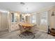 Cozy dining room with a round table, four chairs, and built in cabinet display at 617 Fairmount Dr, North Port, FL 34287