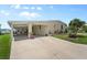 Charming single story home with a covered carport and well maintained lawn at 617 Fairmount Dr, North Port, FL 34287