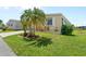 Charming home with a well-maintained lawn, lush landscaping, and proximity to the waterfront at 617 Fairmount Dr, North Port, FL 34287