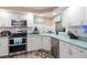 Bright kitchen with stainless steel appliances and ample storage space at 617 Fairmount Dr, North Port, FL 34287