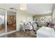 Enclosed lanai with comfortable seating and views into living space at 617 Fairmount Dr, North Port, FL 34287
