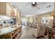 Open-concept living area with breakfast bar connecting to kitchen, ideal for entertaining at 617 Fairmount Dr, North Port, FL 34287