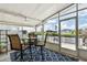 Enjoy outdoor dining on a covered patio with canal views at 617 Fairmount Dr, North Port, FL 34287