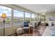 Bright sunroom with water views, perfect for a home office or relaxation at 617 Fairmount Dr, North Port, FL 34287