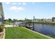Beautiful waterfront view of houses lining a canal with maintained lawns and docks at 617 Fairmount Dr, North Port, FL 34287