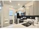 Kitchen with stainless steel appliances, light gray cabinets, black backsplash at 6253 Whetstone Ct, Palmetto, FL 34221