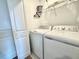 A clean laundry room featuring a full-size washer and dryer at 6253 Whetstone Ct, Palmetto, FL 34221