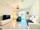 Bright living room with tile flooring, modern furniture, and ample natural light at 6253 Whetstone Ct, Palmetto, FL 34221