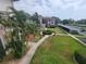 Aerial view of the condo community featuring lush landscaping, mature trees, and convenient parking at 6507 Stone River Rd # 302, Bradenton, FL 34203