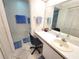 Bright bathroom featuring a vanity, a toilet, and a glass door to the shower at 6507 Stone River Rd # 302, Bradenton, FL 34203