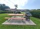 Outdoor grilling area with a picnic table for residents' enjoyment at 6507 Stone River Rd # 302, Bradenton, FL 34203
