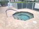 The inviting community hot tub sits adjacent to the pool at 6507 Stone River Rd # 302, Bradenton, FL 34203