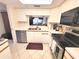 Bright kitchen features stainless steel appliances, white cabinets, and an open view to the living space at 6507 Stone River Rd # 302, Bradenton, FL 34203