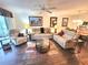 Inviting living room with neutral tones, ceiling fan, comfortable furniture, and an open layout perfect for entertaining at 6507 Stone River Rd # 302, Bradenton, FL 34203