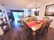 Bright living room features a dining area, comfortable seating, and access to a balcony with scenic views at 6507 Stone River Rd # 302, Bradenton, FL 34203
