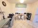 Functional office space featuring an office setup, a table with chairs, and natural light for a productive work environment at 6507 Stone River Rd # 302, Bradenton, FL 34203