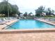 The inviting pool has surrounding lounge chairs and offers a relaxing atmosphere at 6507 Stone River Rd # 302, Bradenton, FL 34203