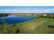 Breathtaking aerial view of the golf course, lake, and residential area beyond at 6512 Grand Estuary Trl # 101, Bradenton, FL 34212