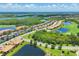 Stunning aerial view of community with golf course, ponds and beautiful landscaping at 6512 Grand Estuary Trl # 101, Bradenton, FL 34212