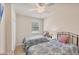 Bedroom with twin beds, ceiling fan, and a window with blinds at 6512 Grand Estuary Trl # 101, Bradenton, FL 34212