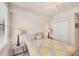 Bright bedroom with ceiling fan, side tables and closet at 6512 Grand Estuary Trl # 101, Bradenton, FL 34212