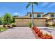 Beautiful home featuring a two-car garage, well-manicured lawn and tasteful landscaping at 6512 Grand Estuary Trl # 101, Bradenton, FL 34212