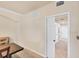 Hallway view featuring neutral paint, tile floors, and doors at 6512 Grand Estuary Trl # 101, Bradenton, FL 34212