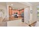 The kitchen features stainless steel appliances and a granite-topped island at 6512 Grand Estuary Trl # 101, Bradenton, FL 34212