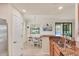 Bright eat-in kitchen features granite counters, stainless appliances, and view of backyard at 6512 Grand Estuary Trl # 101, Bradenton, FL 34212
