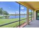 Spacious screened lanai offers scenic water views and seamless indoor-outdoor living at 6512 Grand Estuary Trl # 101, Bradenton, FL 34212