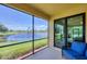 Relaxing screened lanai with a comfortable seating area overlooking a tranquil pond at 6512 Grand Estuary Trl # 101, Bradenton, FL 34212
