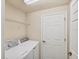 Laundry room with washer, dryer, and wire shelving at 6512 Grand Estuary Trl # 101, Bradenton, FL 34212