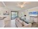 Inviting living space includes a water view, comfortable seating and a neutral color palette at 6512 Grand Estuary Trl # 101, Bradenton, FL 34212