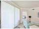 Well-lit living area shows a partial view of the bedroom and relaxing seating area at 6512 Grand Estuary Trl # 101, Bradenton, FL 34212