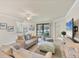 Cozy living room with neutral furniture, an area rug, and a view to the outside at 6512 Grand Estuary Trl # 101, Bradenton, FL 34212