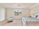Relaxing main bedroom with neutral decor, ceiling fan, and a view of backyard at 6512 Grand Estuary Trl # 101, Bradenton, FL 34212