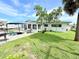Well-maintained backyard features a patio area, sunroom and lush green grass at 8509 La Boca Ave, North Port, FL 34287