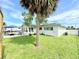 Lush backyard features a patio, beautiful trees and plenty of green space at 8509 La Boca Ave, North Port, FL 34287