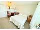 Neutral bedroom featuring a comfortable bed with bright white comforter and decorative accents at 8509 La Boca Ave, North Port, FL 34287