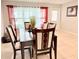 Elegantly furnished dining area with natural light, perfect for Gathering meals and gatherings at 8509 La Boca Ave, North Port, FL 34287