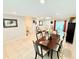 Spacious dining area boasts tile flooring, providing a seamless transition to the living area, perfect for entertaining guests at 8509 La Boca Ave, North Port, FL 34287