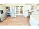 Bright eat-in kitchen featuring granite countertops, stainless appliances, and sliding glass doors to the backyard at 8509 La Boca Ave, North Port, FL 34287