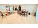 Open concept living space features tile flooring, dining area, and cozy seating, perfect for modern living and entertaining at 8509 La Boca Ave, North Port, FL 34287