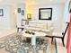Bright living room with a plush white sofa, decorative rug, and stylish decor at 8509 La Boca Ave, North Port, FL 34287
